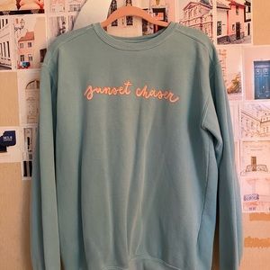 Discontinued All Things Lilly Ann Sunset Chaser Teal Crewneck